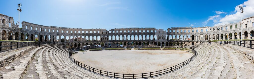 The Roman amphitheatre in Pula seen from outside at golden hour