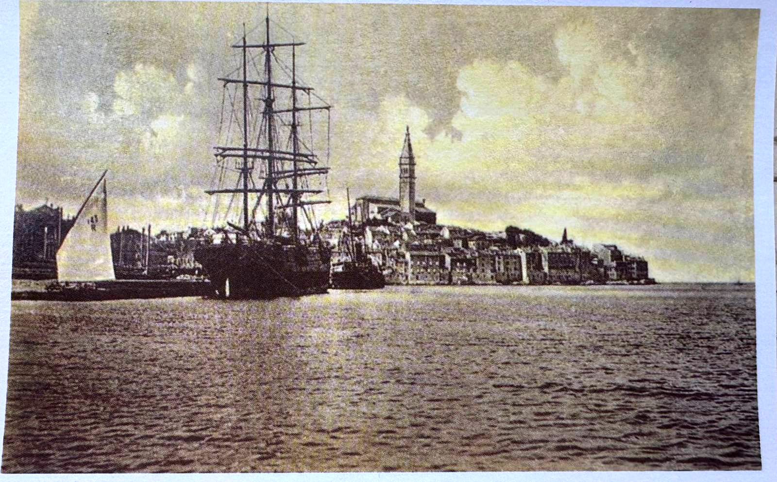 Vintage sepia postcard of a tall ship anchored off the Rovinj peninsula
